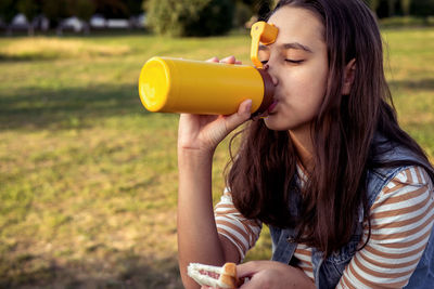 Young woman drinking water