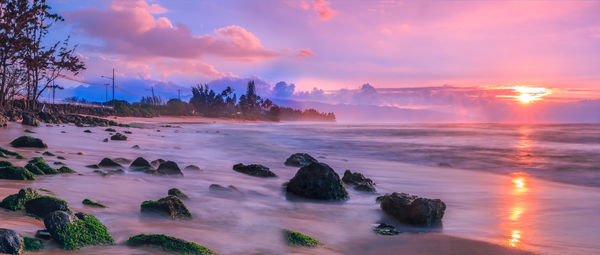 Scenic view of sea against sky during sunset