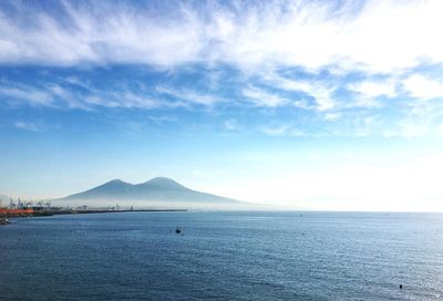 Scenic view of sea against cloudy sky