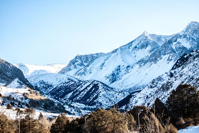 Scenic view of snowcapped mountains against clear sky
