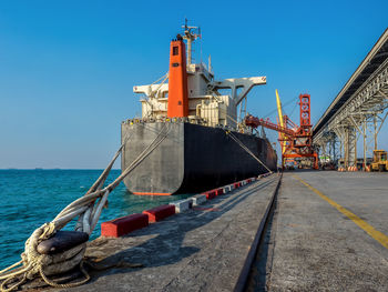 View of ship in sea against clear sky