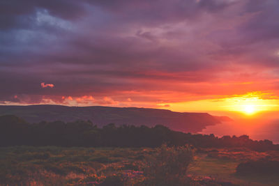 Scenic view of dramatic sky during sunset