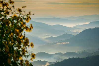 Scenic view of mountains against sky during sunset