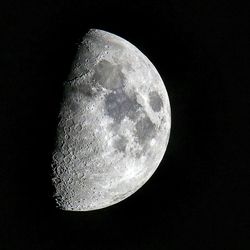 Low angle view of moon against clear sky at night