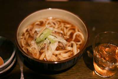 Close-up of soup with drink on table