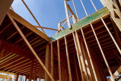 Low angle view of building under construction against sky