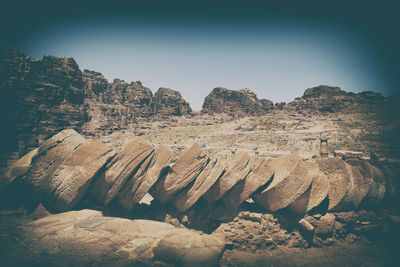 Rock formations on landscape against sky