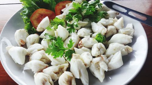 High angle view of chopped vegetables in bowl on table