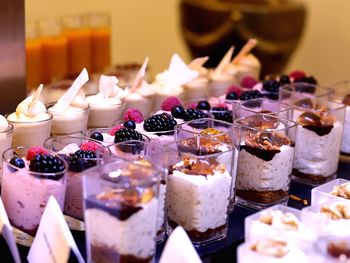 High angle view of desserts in glasses on table