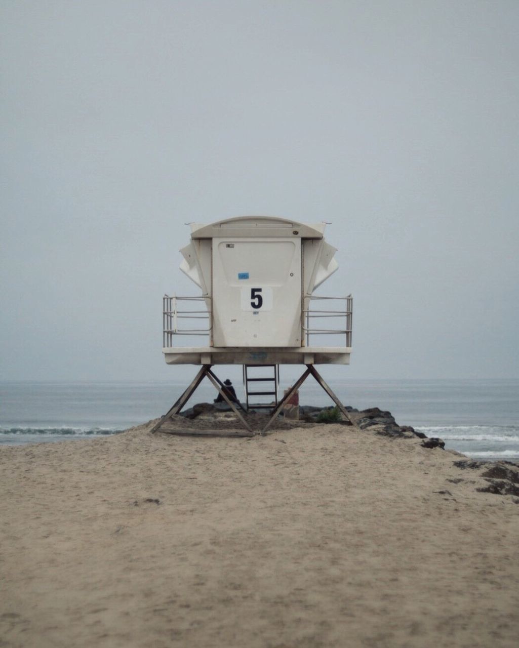 LIFEGUARD HUT AT BEACH AGAINST SKY