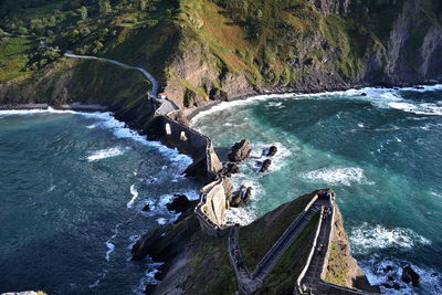 High angle view of waterfall by sea