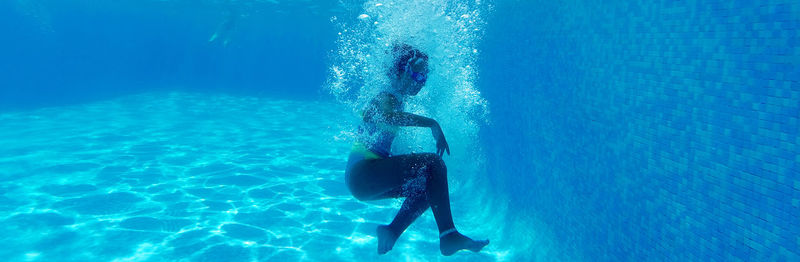 Man swimming in pool