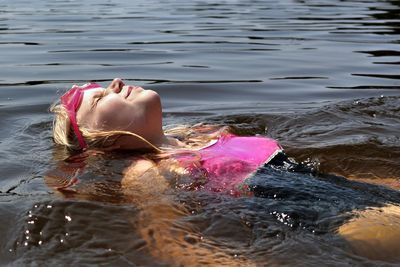 Girl swimming in lake