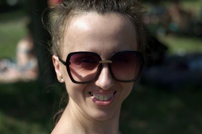 Portrait of young woman wearing sunglasses