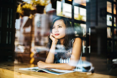 Portrait of woman sitting in cafe