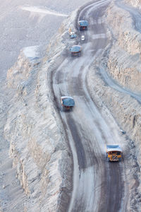 High angle view of trucks moving on road