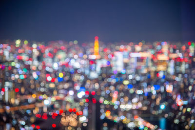 Night blurred bokeh light japan city office building, abstract background
