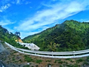 High angle view of road by mountain against sky