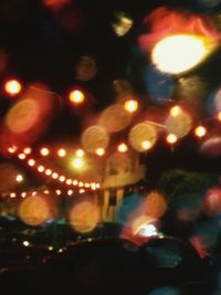 Close-up of illuminated lights at night