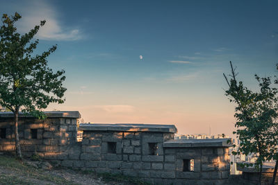 Buildings against sky during sunset