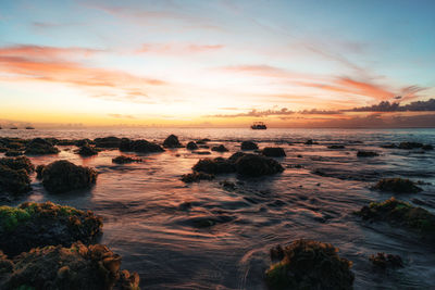 Scenic view of sea against sky during sunset