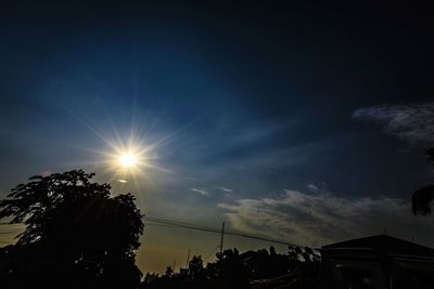 Low angle view of silhouette trees against sky during sunset