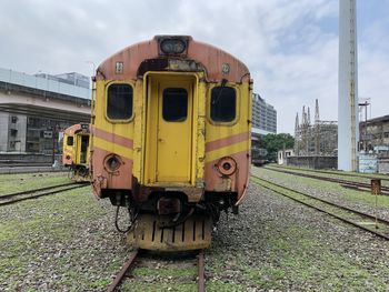 Train on railroad track against sky