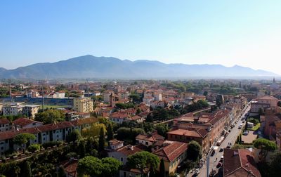 High angle view of houses in town against clear sky