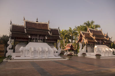 View of temple against building