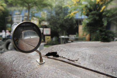 Close-up of vintage car on street. old car rearview mirror