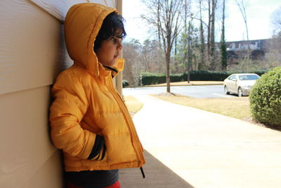 Boy standing in backyard