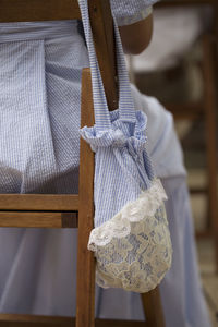 Close-up of mannequin hanging on seat