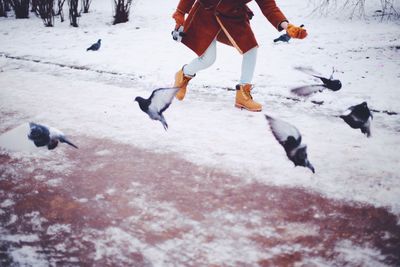 Low section of photographer in winter