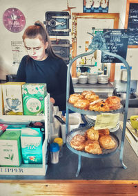 High angle view portrait of a girl having food on table