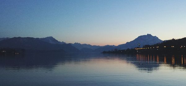 Scenic view of lake with mountains in background