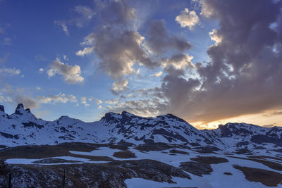 Half snowy mountain landscape at sunset in pyrenees, spain