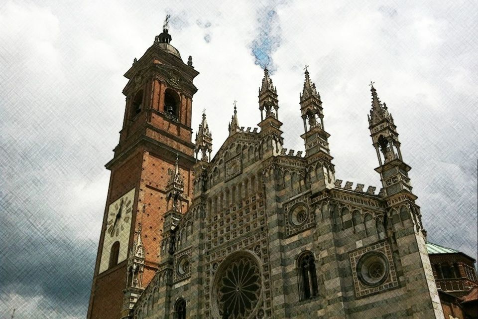 architecture, building exterior, low angle view, built structure, sky, tower, clock tower, religion, church, place of worship, history, cloud - sky, tall - high, travel destinations, famous place, cathedral, clock, spirituality