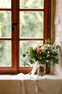 Flower vase on window sill