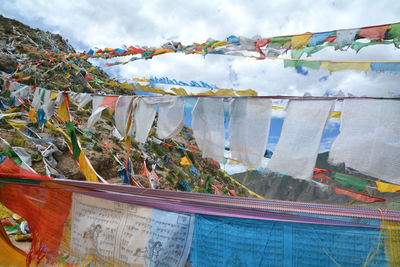 Clothes drying on clothesline against sky