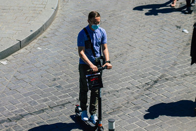 High angle view of friends standing on street