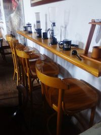 Close-up of chairs on table