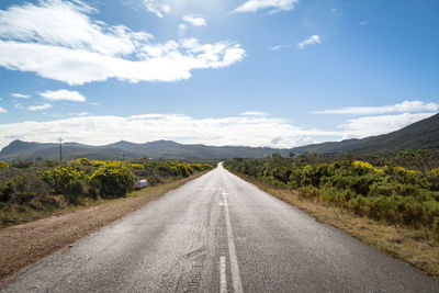 Close-up of road with sky in background