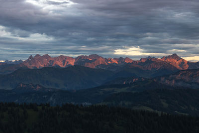 Scenic view of mountains against dramatic sky