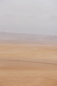 Scenic view of desert against sky