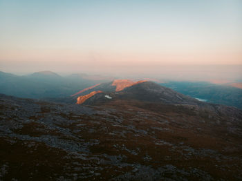 Scenic view of mountains against sky during sunset