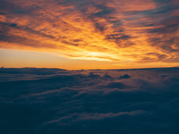 Low angle view of dramatic sky during sunset