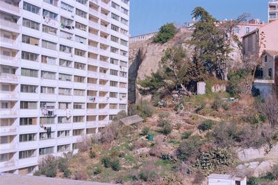 Exterior of buildings in town against sky