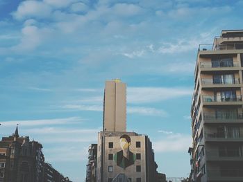 Buildings in city against sky