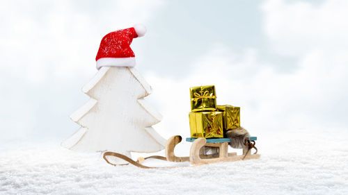 Christmas decorations on snow covered land
