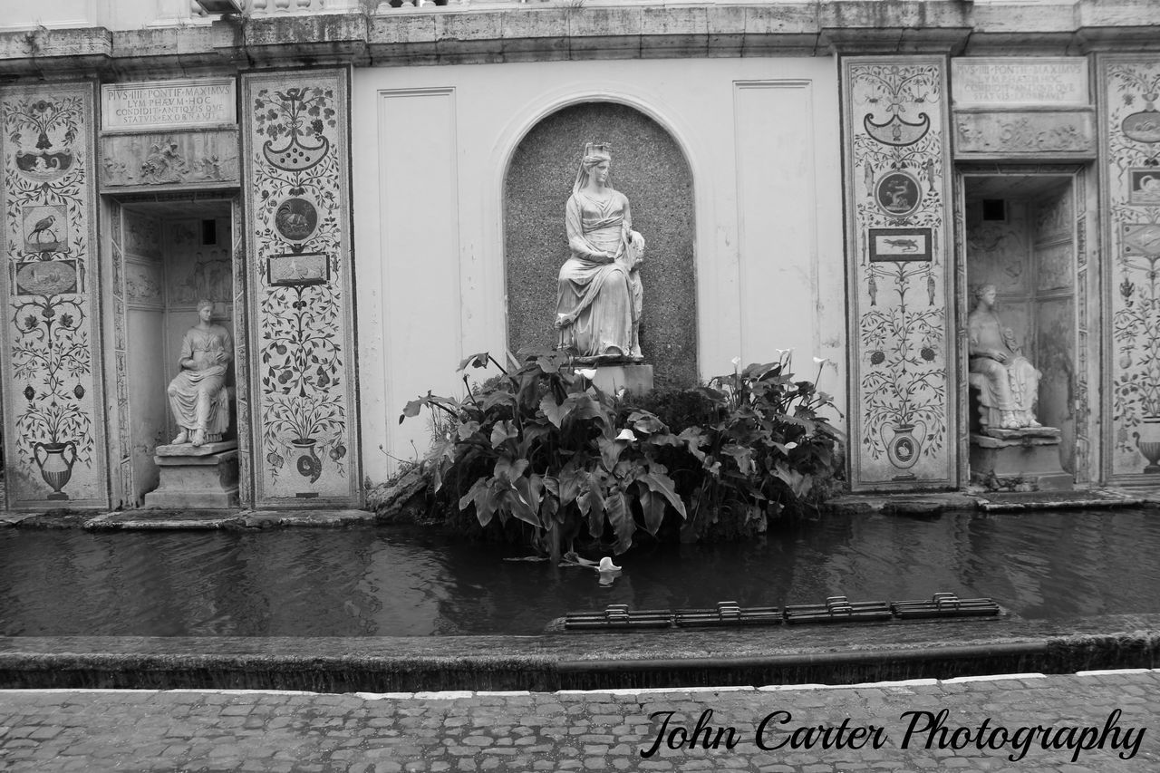 VIEW OF STATUE AGAINST THE WALL